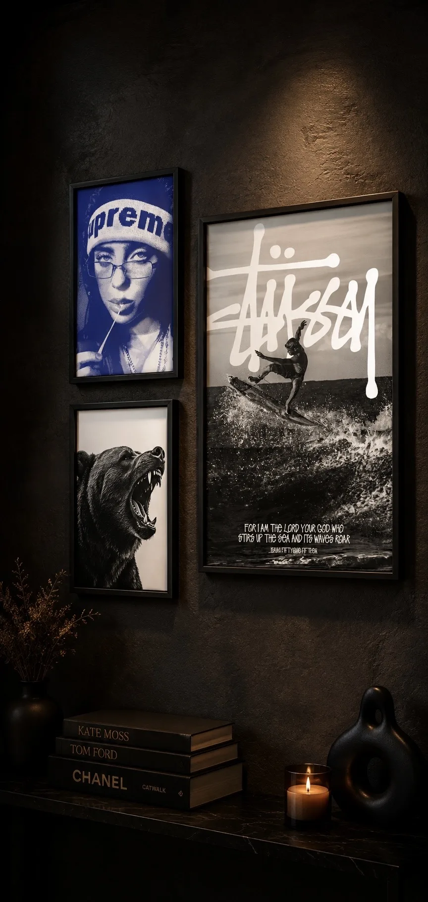 Three framed wall-art posters displayed on a dark textured gallery wall